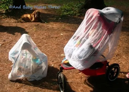 camping with a baby with mosquito netting over stroller