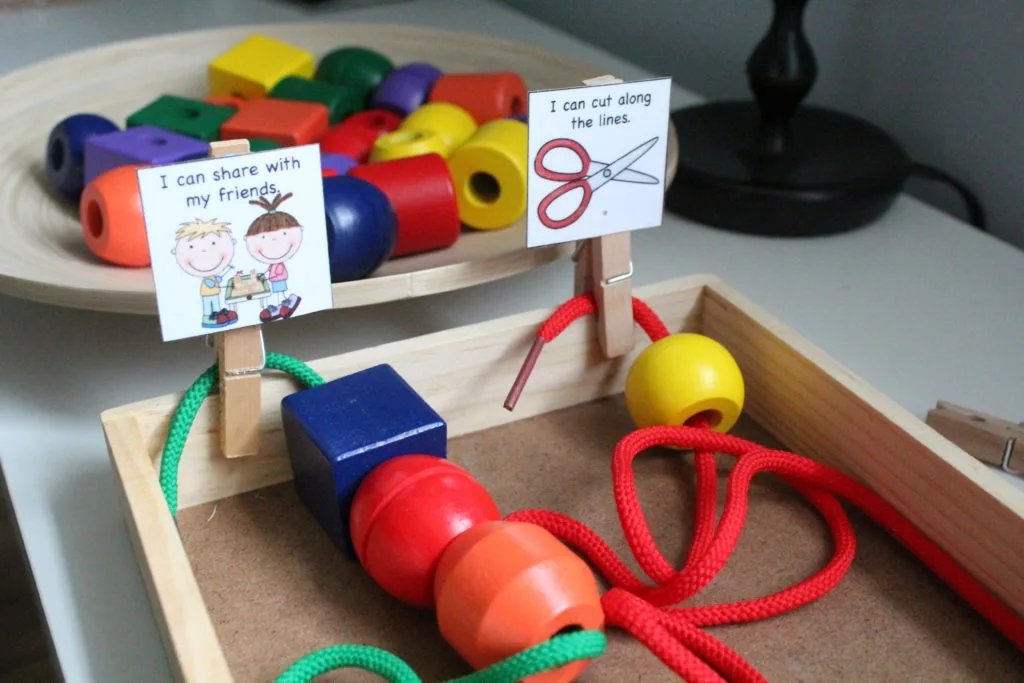 wooden beads on strings in a tray