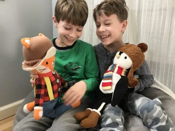 A young boy holding a teddy bear