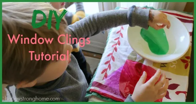 Child making DIY window clings