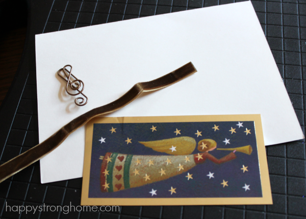 Card with white paper and embellishments on mat