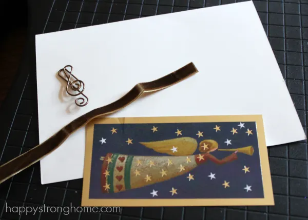 Card with white paper and embellishments on mat