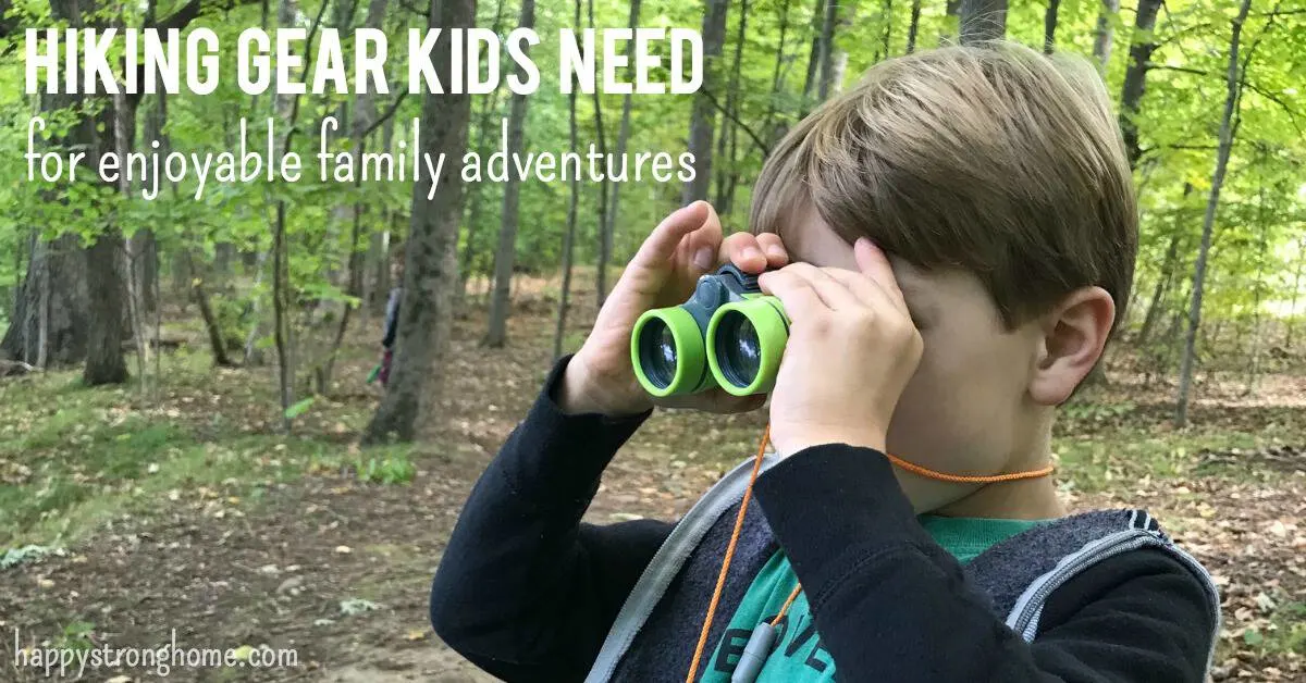 child looking through binoculars