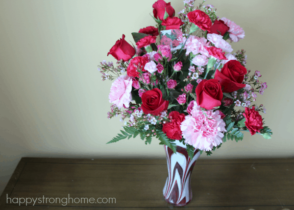 A bouquet of flowers in a vase on a table