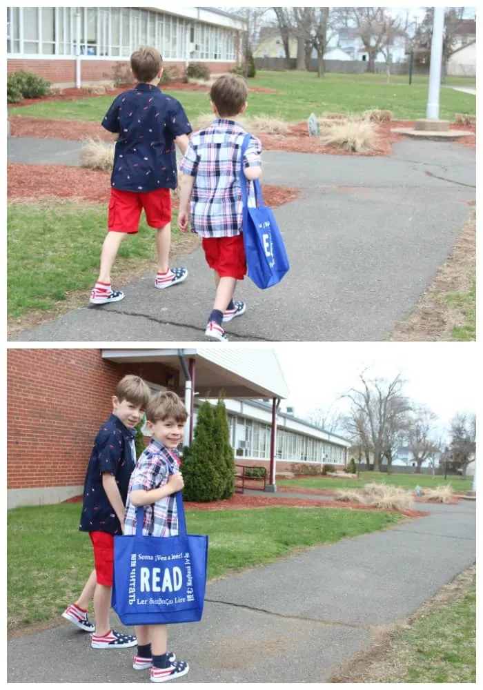 two kid that are walking next to a building