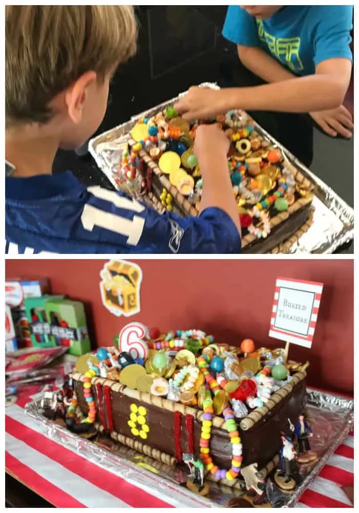 children take candy off a pirate treasure chest cake for pirate birthday party ideas