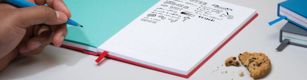 left handed kids lay flat notebook, writing 