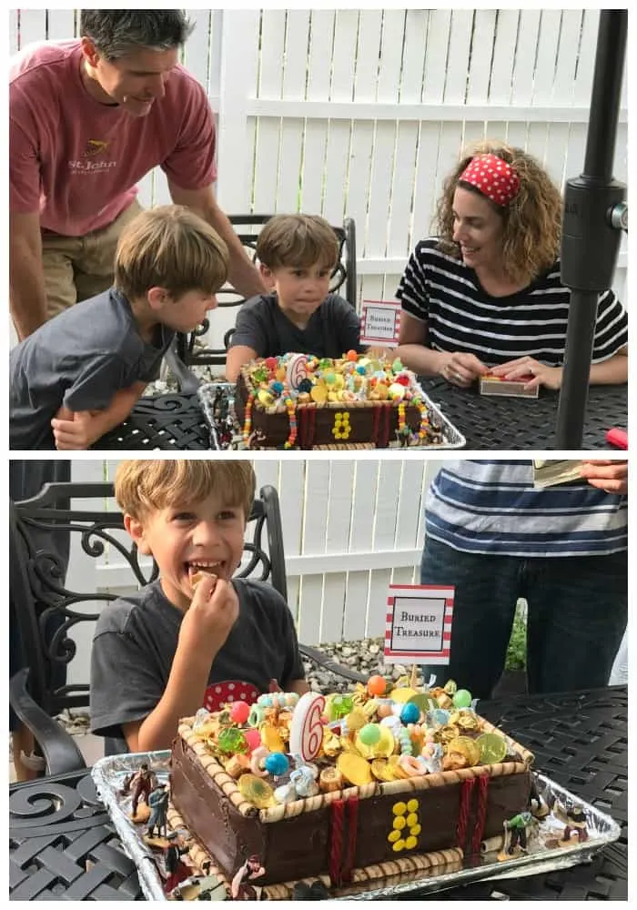 family celebrates birthday with pirate birthday party ideas and cake