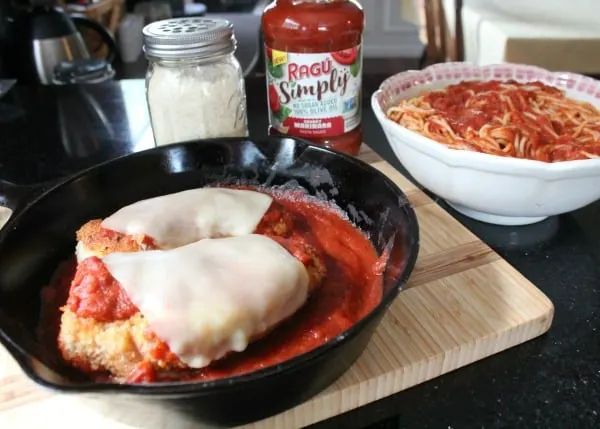 A pan of chicken in a skillet on a table