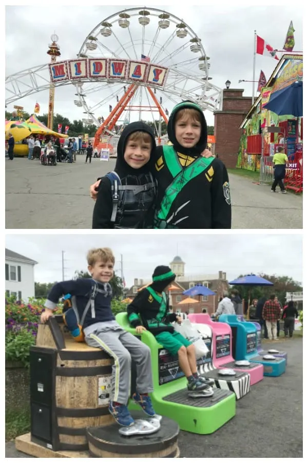 boys posing in front of a ferris wheel at The Big E