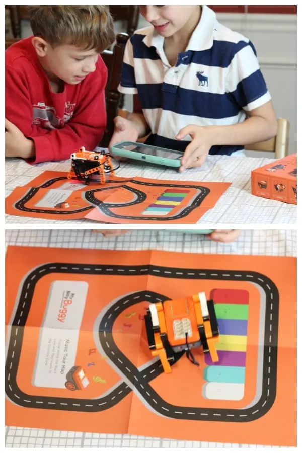 A group of people playing with a robot toy