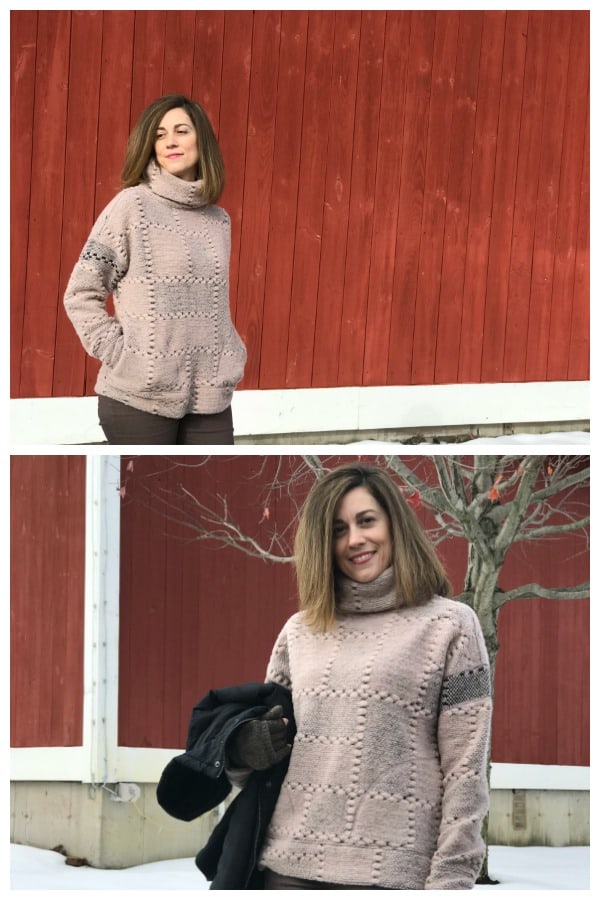 A woman wearing a pink sweater standing in front of a building 