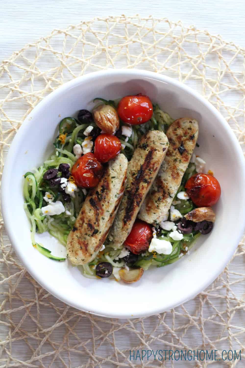 Mediterranean Chicken Sausage over zoodles in bowl