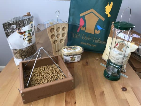 Bird feeders and seeds on a table