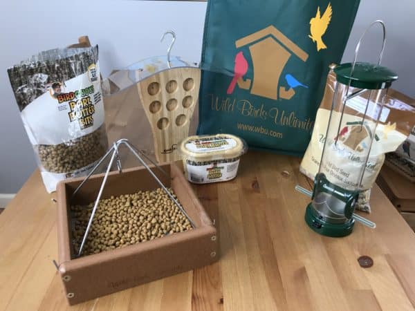 Bird food in feeder on table