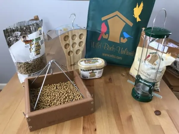 Bird feeders and seeds on a table