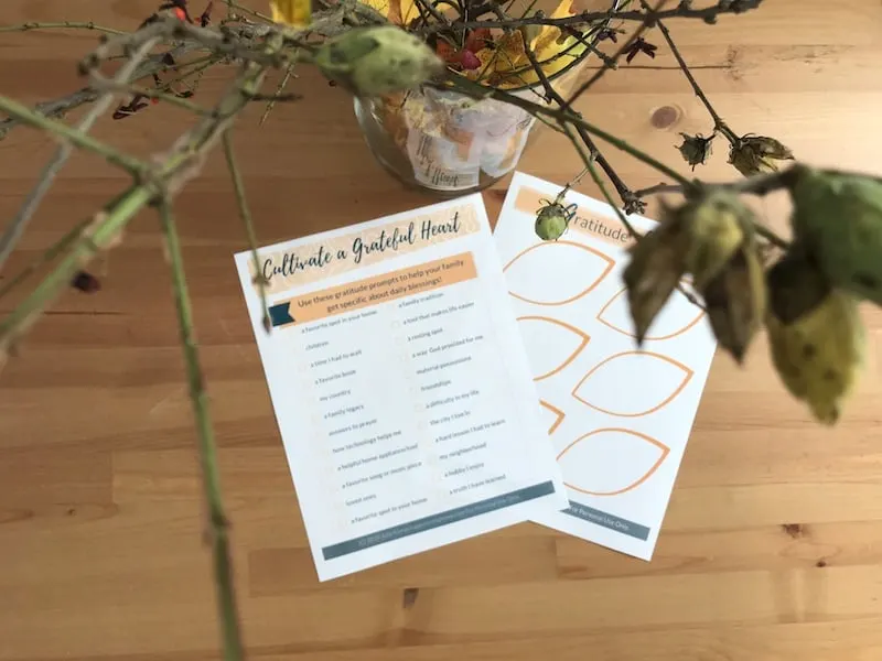 Orange and blue printed pages of Thanksgiving gratitude prompts