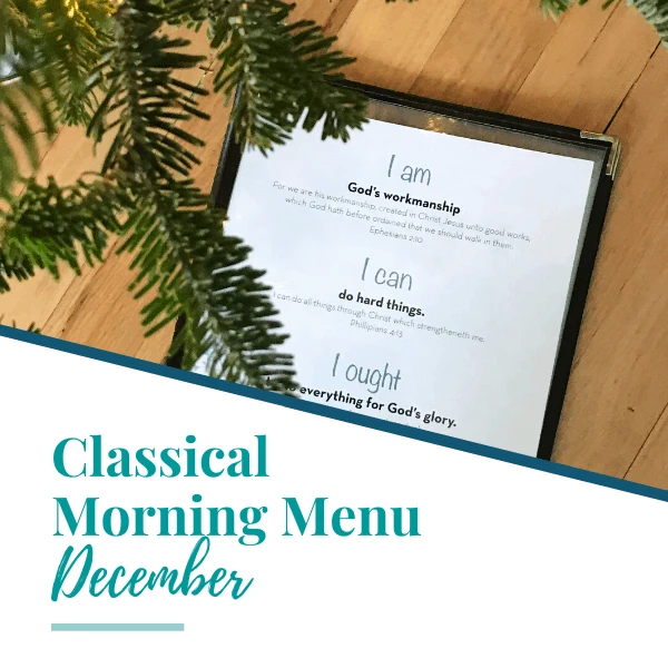 Close up of a plastic menu with printable affirmations inside and a pine tree branch decoration