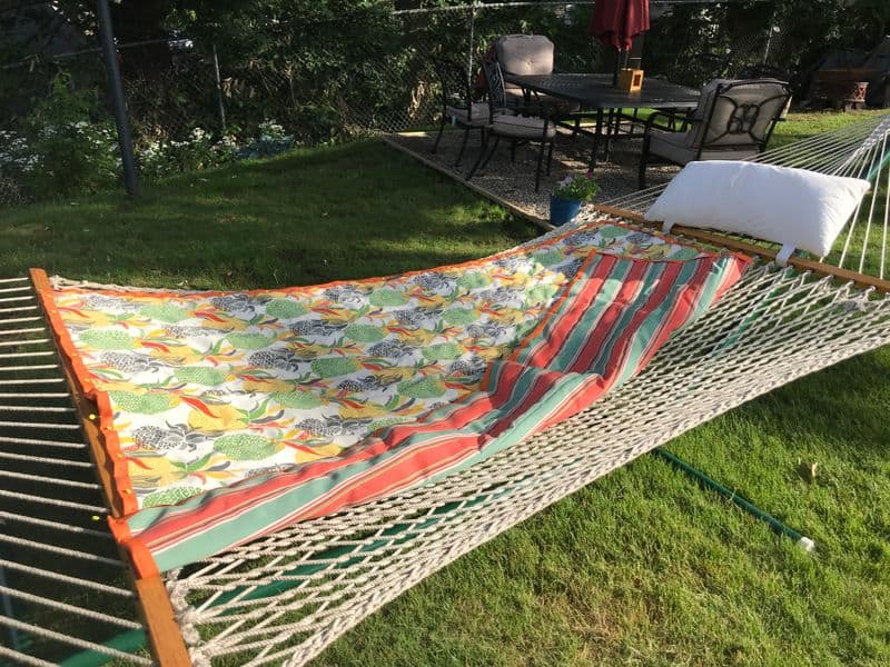 A hammock in a yard covered with a printed hammock cover sewing craft