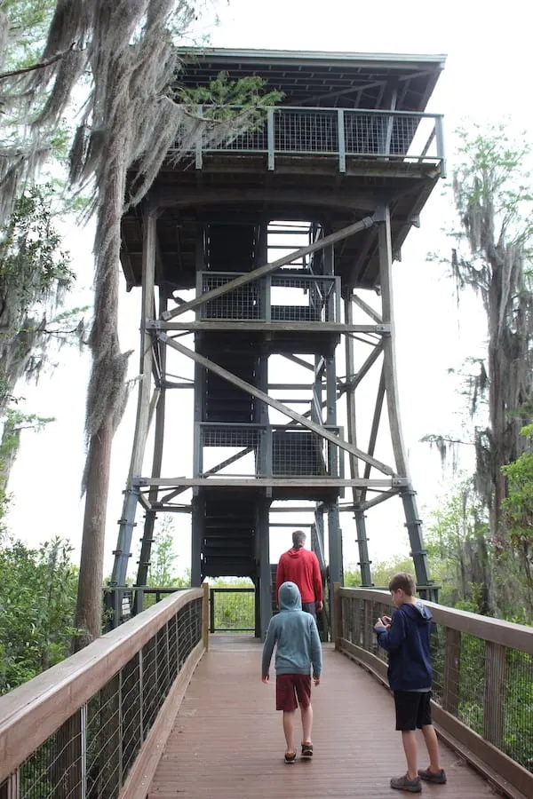 A group of people walking on a bridge