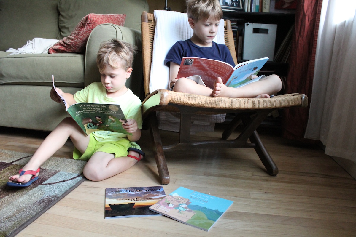two boys reading together