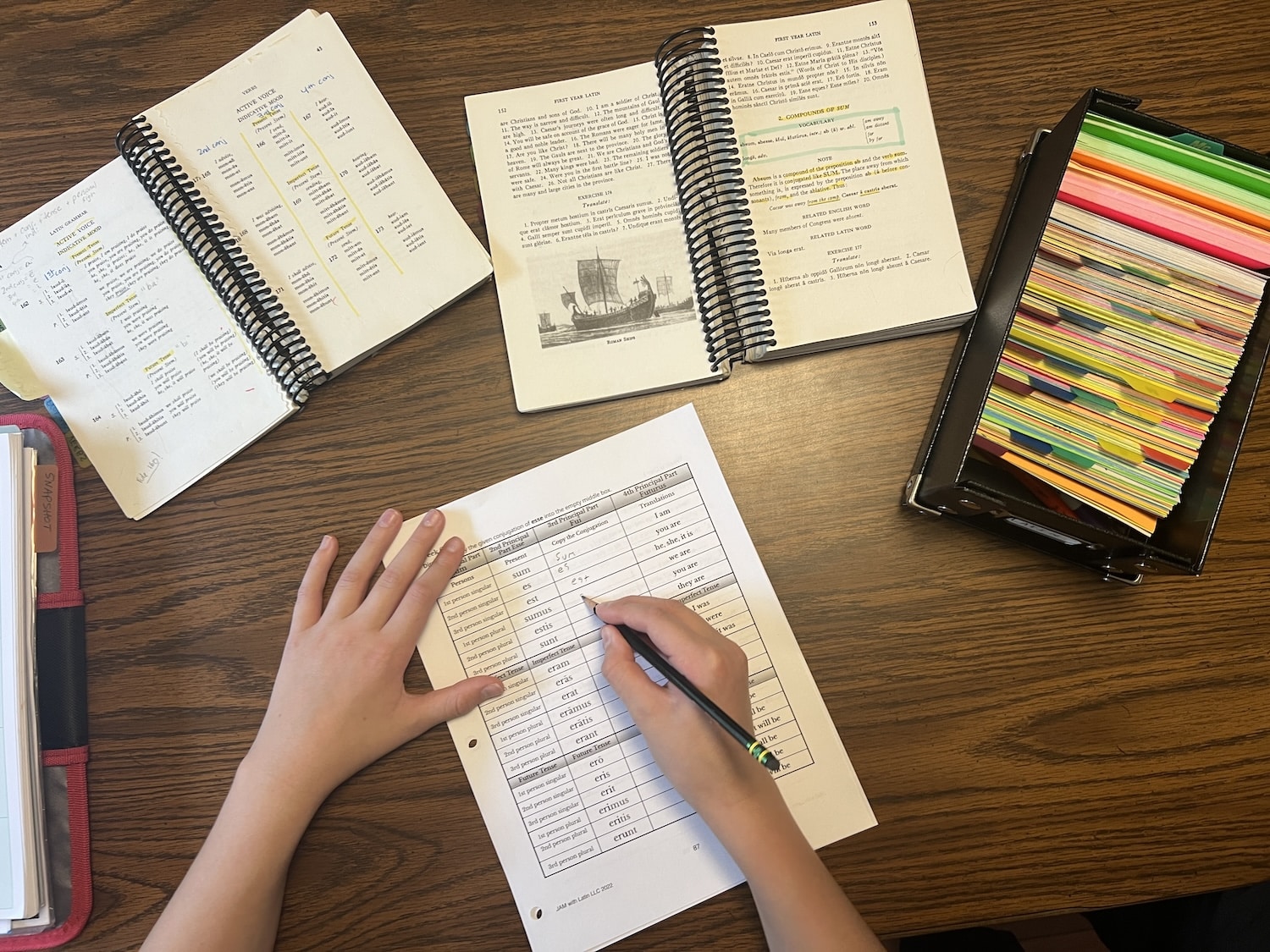 Overhead view of student filling out a JAM with Latin worksheet